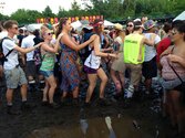 the-mud-became-so-hard-to-manage-that-people-had-to-conga-line-their-way-through-the-fields.jpg