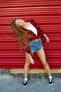 beautiful-girl-having-fun-dancing-waving-hair-outdoor-b_002.webp