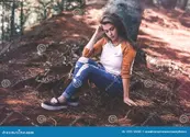 woman-sitting-ground-109915145.webp
