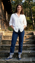 freepik__young-debra-winger-wearing-white-shirt-cuffed-jean__5238.png