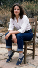 freepik__young-debra-winger-wearing-white-shirt-cuffed-jean__5231.png