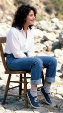 freepik__young-debra-winger-wearing-white-shirt-cuffed-jean__5233.png
