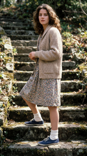 freepik__young-debra-winger-wearing-cardigan-sweater-floral__45112.png