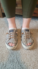 freepik__img1-shoes-are-worn-down-and-slightyl-dirty-canvas__91389.png