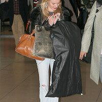120704Kate Bosworth arrives at JFK Airport in New York.jpg