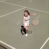 1960-1960s-retro-smiling-woman-playing-tennis-swinging-racket-to-hit-CMRP9R.jpg