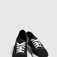 pikaso_texttoimage_pair-of-womens-black-Keds-sneakers-have-a-simple-s.jpeg
