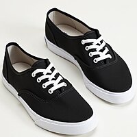 pikaso_texttoimage_pair-of-womens-black-Keds-sneakers-have-a-simple-s-4.jpeg
