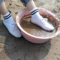 chinese girl playing mud with white keds.mp4