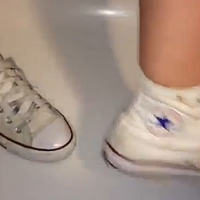 white high converse crushing a blood orange.mp4