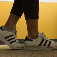 adidas and socks under a table.mp4