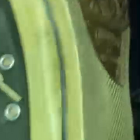 Girl showing her pretty barefeet through her ripped converse