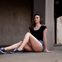 free-photo-of-woman-sitting-by-column.jpeg