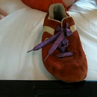 Getting ready for a run in my worn out red sneakers.mp4