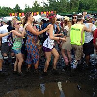 the-mud-became-so-hard-to-manage-that-people-had-to-conga-line-their-way-through-the-fields.jpg