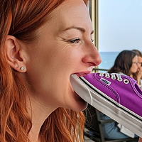 Hailuo_Video_The woman is holding a sneaker_403464794448494593.mp4