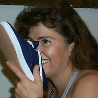 Gen-4 Turbo A beautiful 25 year old woman with wavy auburn hair and sexy eyes is sniffing the ...mp4