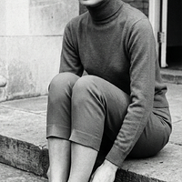 freepik__young-audrey-hepburn-wearing-navy-blue-keds-with-t__90426.png
