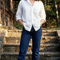 freepik__young-debra-winger-wearing-white-shirt-cuffed-jean__5238.png