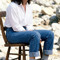 freepik__young-debra-winger-wearing-white-shirt-cuffed-jean__5233.png