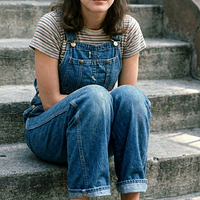 freepik__young-sean-young-wearing-img1-sitting-on-steps-fro__5196.png