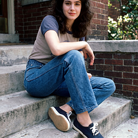 freepik__young-sean-young-wearing-img1-img2-img3-sitting-on__5204.png