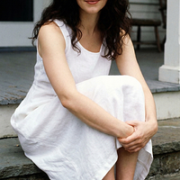 freepik__young-madeleine-stowe-wearing-white-dress-and-slig__5177.png